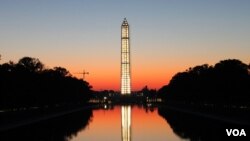 The National Park Service illuminated the Washington Monument using more than 400 lights lit from within while undergoing repairs as a result of an August 23, 2011 earthquake, Washington, DC, October, 2013. (Brian Allen/VOA)