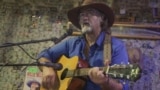 Michael Fox singing at the Oatman Hotel