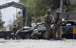 NATO-led Resolute Support forces inspect the site of a car bomb explosion in Kabul, Afghanistan, Sept. 5, 2019.