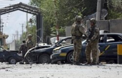 NATO-led Resolute Support forces inspect the site of a car bomb in Kabul, Afghanistan, Sept. 5, 2019.