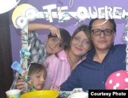 Fernando Villavicencio and Veronica Sárauz pose with two of their three children in happier times, shown in a photo provided by Sárauz.