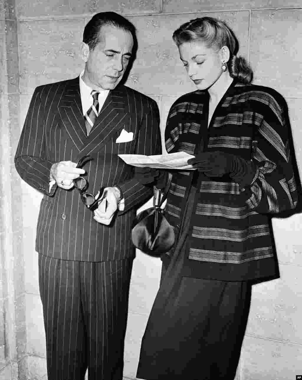 US actor Humphrey Bogart and his actress wife, Lauren Bacall, attend a dinner at the Biltmore Bowl, Hollywood, Los Angeles, California, United States, on Dec. 9, 1946. (AP Photo)
