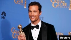 Actor Matthew McConaughey poses backstage with his award for Best Actor in a Motion Picture, Drama for his role in "Dallas Buyers Club" at the 71st annual Golden Globe Awards in Beverly Hills, California, Jan. 12, 2014.