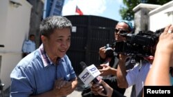 A Taiwanese citizen identified only as "William" speaks with the media outside the Taiwan embassy on August 21, 2018.