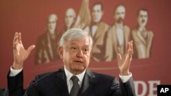 Mexico's President Andres Manuel Lopez Obrador holds his first news conference as president in Mexico City, Monday, Dec. 3, 2018. (AP Photo/Christian Palma)