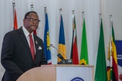 FILE - Malawi President Lazarus Chakwera makes an acceptance speech after taking over the Southern African Development Community (SADC) Chairmanship, in Lilongwe, Malawi, on Aug. 17, 2021.