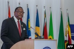 FILE - Malawi President Lazarus Chakwera makes an acceptance speech after taking over the Southern African Development Community (SADC) Chairmanship, in Lilongwe, Malawi, on Aug. 17, 2021.