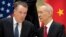 FILE - Chinese Vice Premier Liu He, right, talks with U.S. Trade Representative Robert Lighthizer, while they line up for a group photo in Beijing, Feb. 15, 2019.. 