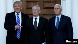 U.S. President-elect Donald Trump (L) and Vice President-elect Mike Pence (R) greet retired Marine General James Mattis in Bedminster, New Jersey, U.S., Nov. 19, 2016.