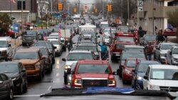 FILE - Vehicles sit in gridlock during a protest in Lansing, Mich., April 15, 2020.