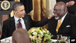 President Barack Obama talks with Texas-based evangelist Bishop T.D. Jakes during a Easter Prayer breakfast with Christian leaders in the East Room of the White House, April 19, 2011