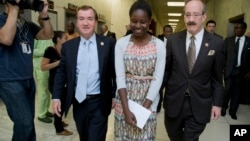 Boko Haram survivor, Deborah Peter, center, walks with House Foreign Affairs Committee Chairman Rep. Ed Royce, R-Calif., left, and, the committee's ranking member Rep. Eliot Engel, D-N.Y. to a hearing room on Capitol Hill in Washington, Wednesday, May 21, 2014. (File Photo)