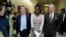 Deborah Peter, center, walks with House Foreign Affairs Committee Chairman Rep. Ed Royce, R-Calif., left, and, the committee's ranking member Rep. Eliot Engel, D-N.Y. to a hearing room on Capitol Hill in Washington, Wednesday, May 21, 2014.