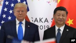 29 Haziran 2019, Osaka, Japonya - ABD Başkanı Donald Trump ile Çin Devlet Başkanı Xi Jinping'in G-20 zirvesi sırasında görüşmesi