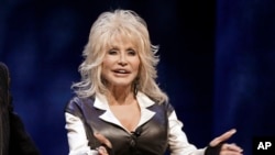 FILE - This Jan. 19, 2012 file photo shows entertainer Dolly Parton during a news conference in Nashville, Tenn.