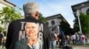 A supporter of former Prime Minister Najib Razak waits outside the Court of Appeals, in Putrajaya, Malaysia, Jan. 6, 2025, before Najib won an appeal to pursue his bid to serve his remaining corruption sentence under house arrest later Monday. 