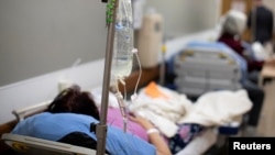 Patients are held in the hallway as St. Mary Medical Center resorts to using tents outside to handle the overflow at its 200 bed hospital during the outbreak of the coronavirus disease (COVID-19) in Apple Valley, California, U.S., January 12, 2021.