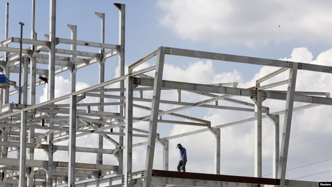 FILE - A man works at a construction site of a foreign invested project in Vietnam's southern financial hub Ho Chi Minh city, Aug. 27, 2015. Vietnam's top leaders are looking to attract more foreign investment in manufacturing. (Reuters)