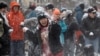 People participate in snowball fight at Meridian Hill Park, as a winter storm that brought snow, ice and freezing temperatures to a broad swath of the U.S. hits Washington, Jan. 6, 2025. 