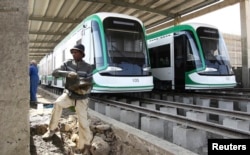FILE - A worker works on the electrified light rail transit construction site in Ethiopia&rsqo;s capital, Addis Ababa, Dec. 16, 2014. The project was built by China Railway Engineering Corporation (CREC) and mostly financed through a loan from China’s Exim Bank.