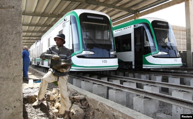 FILE - A worker works on the electrified light rail transit construction site in Ethiopia&rsqo;s capital, Addis Ababa, Dec. 16, 2014. The project was built by China Railway Engineering Corporation (CREC) and mostly financed through a loan from China’s Exim Bank.