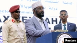 Ahmed Mohamed Madobe, president of the Jubbaland region, takes the oath of office after winning re-election, in the southern port town of Kismayo, Somalia, Aug. 22, 2019.