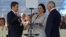 Honduran President Juan Orlando Hernandez, accompanied by his wife, Ana Garcia de Hernandez, and President of the National Congress of Honduras Mauricio Oliva, is sworn in for a new term at the Tiburcio Carias Andino National Stadium in Tegucigalpa, Honduras, Jan. 27, 2018. 