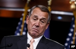 FILE - House Speaker John Boehner reacts to last week's impasse on Homeland Security funding. On Tuesday, the House approved a bill without provisions.