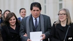 Former Guatemalan soccer federation president Brayan Jimenez, center, leaves U.S. District Court in the Brooklyn borough of New York, Feb. 5, 2019. 