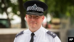 Metropolitan Police Inspector Jim Cole poses for a photo at New Scotland Yard, London, where he described his role in the police response to the London Bridge attack, June 9, 2017. One of the first police officers on the scene of the London Bridge attack says he was met by pandemonium. 