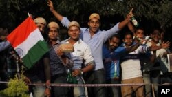 Indian cricket fans line up to get inside the Chinnaswamy Stadium, the venue of first Twenty20 cricket match between India and Pakistan, in Bangalore, India, December 25, 2012. 