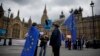 Anti-Brexit and remain in the European Union supporters stand near Houses of Parliament in London, April 3, 2019. After failing to win Parliament's backing for her Brexit blueprint, Britain's Prime Minister Theresa May changed gears, saying she would seek a compromise.