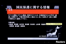 The Japanese government's alert message, called a J-alert, notifying citizens of a ballistic missile launch by North Korea is seen on a television screen in Tokyo, Sept. 15, 2017.