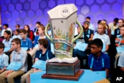 The Scripps National Spelling Bee trophy sits in front of competitors during the second round, May 28, 2019, in Oxon Hill, Md.