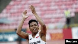 Lalu Muhammad Zohri merayakan kemenangan di kejuaraan lari putra 100 meter di IAAF World U20 Championship 2018 di Tampere, Finlandia, 11 Juli 2018.