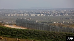 A picture taken from the Israeli-annexed Golan Heights Feb. 4, 2021, shows the border fence with the Syrian governorate of Quneitra.