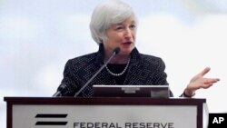 FILE - Federal Reserve Chairman Janet Yellen speaks during a conference on economic opportunity at the Federal Reserve Bank in Boston.