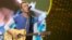 FILE - Chris Martin from the band Coldplay performs at MetLife Stadium in East Rutherford, New Jersey, July 16, 2016. 