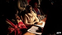 Malawian Electoral Commission officers gets ready to count ballots at a polling station during the Malawi Tripartite general elections on May 21, 2019 in Lilongwe, Malawi. - Malawi went to the polls on May 21 in a high-stakes election with a charged oppo