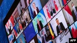 FILE - Russia's President Vladimir Putin, China's President Xi Jinping, Turkey's President Recep Tayyip Erdogan, UK Prime Minister Boris Johnson, U.S. President Joe Biden and others are shown during a climate change virtual summit, April 22, 2021.