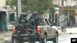 Police patrol sections of downtown Kingston, Jamaica, 24 May 2010