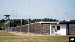 FILE - This April 16, 2018 photo shows the Lee Correctional Institution in Bishopville, S.C. In 2018, seven inmates at the maximum-security prison were killed in what officials have said was a gang fight over territory and contraband including cellphones.