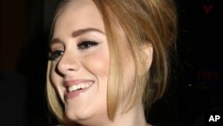 British singer Adele greets her fans after her concert at Radio City Music Hall on Nov. 17, 2015 in New York.