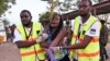Paramedics help a student who was injured during an attack by Somalia's al-Qaida-linked al-Shabab gunmen at Garissa University College, Kenya, April 2, 2015. 