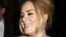 British singer Adele greets her fans after her concert at Radio City Music Hall on Nov. 17, 2015 in New York. Tickets for Adele's first concert tour of North America in five years sold out within minutes for venues on the U.S. East Coast on Dec. 17, 2015.