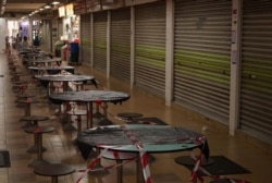 Stalls are shuttered at Hong Lim Hawker Centre in Singapore, May 10, 2020, amid the coronavirus outbreak. COVID-19 cases in Singapore recently spiked to 700 to 800 per day.