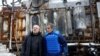 Ukrainian Energy Minister German Galushchenko, left, and International Atomic Energy Agency Director General Rafael Grossi, right, visit an energy infrastructure facility damaged during Russian missile and drone strikes in an undisclosed location in Ukraine, Feb. 4, 2025.