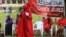 A member of the Abuja "Bring Back Our Girls" protest group addresses a sit-in demonstration organized by the group at the Unity Fountain in Abuja, Nigeria, June 23, 2014. 