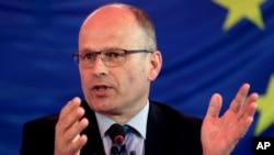 FILE- Chief Observer of EU Election Assessment Team, Thijs Berman speaks during a press conference in Kabul, April 7, 2014.