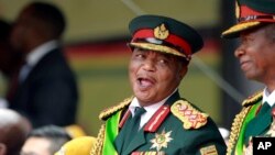 FILE: Army General Constantino Chiwenga smiles during the presidential inauguration ceremony in Harare, Zimbabwe, Nov. 24, 2017.